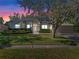 House exterior at dusk showcasing landscaping at 3954 Old Dunn Rd, Apopka, FL 32712