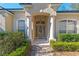 Front entry with columns and landscaping at 3954 Old Dunn Rd, Apopka, FL 32712