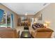 Relaxing living room showcasing comfortable seating and a large TV at 3954 Old Dunn Rd, Apopka, FL 32712