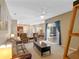 Spacious living room with leather furniture and a view to the kitchen at 3954 Old Dunn Rd, Apopka, FL 32712