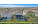 Aerial view of the home showcasing the backyard pool, patio, and overall property layout in a beautiful neighborhood at 471 Lasso Dr, Kissimmee, FL 34747