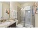Bright bathroom featuring a large vanity, a toilet, and a glass shower enclosure at 471 Lasso Dr, Kissimmee, FL 34747