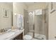 Bathroom with a glass shower, granite countertop, sink, and toilet with ceramic tile floors at 471 Lasso Dr, Kissimmee, FL 34747