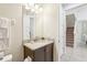Well-lit bathroom with granite countertop, modern fixtures, and ample vanity storage space at 471 Lasso Dr, Kissimmee, FL 34747