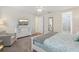 Serene bedroom featuring soft carpeting, stylish dresser, TV and comfortable reading chair at 471 Lasso Dr, Kissimmee, FL 34747