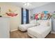 Bedroom featuring two twin beds, cartoon-themed wall art, and ceiling fan at 471 Lasso Dr, Kissimmee, FL 34747