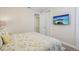 Cozy bedroom showcasing a TV, closet space and colorful, patterned bedding at 471 Lasso Dr, Kissimmee, FL 34747