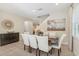 Bright dining room with seating for six, complemented by elegant decor and natural light at 471 Lasso Dr, Kissimmee, FL 34747
