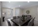 An expansive dining room showcases a lustrous table, ideal for hosting memorable gatherings and celebrations at 471 Lasso Dr, Kissimmee, FL 34747