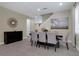 This is a spacious dining room with tile floors, complemented by an elegant table and chairs at 471 Lasso Dr, Kissimmee, FL 34747