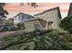 Inviting two-story home with a well-maintained lawn, two car garage, and beautiful landscaping at 471 Lasso Dr, Kissimmee, FL 34747