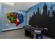 Amusing game room with air hockey table and mural featuring Marvel comic book characters at 471 Lasso Dr, Kissimmee, FL 34747