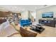 Open-concept living room features stylish furniture and flows into the modern kitchen at 471 Lasso Dr, Kissimmee, FL 34747
