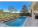 Private pool and spa surrounded by lush landscaping offering a serene outdoor retreat at 471 Lasso Dr, Kissimmee, FL 34747