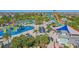 Aerial view of a community waterpark with multiple slides, pools, and lush landscaping at 471 Lasso Dr, Kissimmee, FL 34747