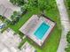 Aerial view of the community pool, showcasing its size and surrounding green space at 7707 Country Pl, Winter Park, FL 32792