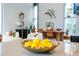 Modern dining area with view of the living space through bright windows at 2661 Via Tuscany, Winter Park, FL 32789