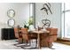 Elegant dining room with modern furniture, natural lighting, and chic decor perfect for entertaining guests at 2661 Via Tuscany, Winter Park, FL 32789