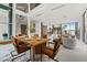 Open-concept dining area showcasing a modern table with seating and expansive views of the community at 2661 Via Tuscany, Winter Park, FL 32789