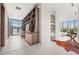 Spacious hallway featuring built-in shelving, stylish decor, and plenty of natural light streaming through the large windows at 2661 Via Tuscany, Winter Park, FL 32789