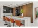 Modern kitchen featuring an island with seating, sleek cabinetry, and high-end stainless steel appliances at 2661 Via Tuscany, Winter Park, FL 32789