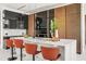 Modern kitchen featuring an island with seating, sleek cabinetry, and high-end stainless steel appliances at 2661 Via Tuscany, Winter Park, FL 32789