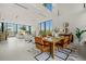 Spacious open-concept living and dining area with expansive windows offering abundant natural light at 2661 Via Tuscany, Winter Park, FL 32789