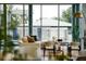Cozy living room with views of the pool and modern decor, creating a relaxing atmosphere at 2661 Via Tuscany, Winter Park, FL 32789