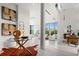 Bright living room with modern decor, floor-to-ceiling windows, and an open layout for seamless entertaining at 2661 Via Tuscany, Winter Park, FL 32789