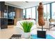 Open-concept living space with modern furnishings, seamless kitchen access, and bright views from large windows at 2661 Via Tuscany, Winter Park, FL 32789