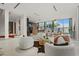Spacious living room with modern design, seamless kitchen access, and floor-to-ceiling windows for natural light at 2661 Via Tuscany, Winter Park, FL 32789