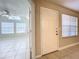 Inviting entryway with tiled floor, natural light, and a view into the spacious living area at 375 Lake Ontario Ct # 102, Altamonte Springs, FL 32701