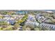 Wide aerial view of neighborhood homes and lake at 2891 Upper Park Rd, Orlando, FL 32814