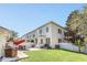 Spacious backyard with patio, lawn area and white fence at 2891 Upper Park Rd, Orlando, FL 32814