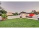 Spacious backyard with lush lawn, patio furniture, and detached structure at 2891 Upper Park Rd, Orlando, FL 32814