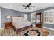 Spacious bedroom with wood flooring, large bed, and ample natural light at 2891 Upper Park Rd, Orlando, FL 32814