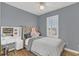 Charming bedroom with a tufted headboard and a vanity area at 2891 Upper Park Rd, Orlando, FL 32814