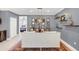 Elegant dining room featuring a rustic wood table, chandelier, and built-in shelving at 2891 Upper Park Rd, Orlando, FL 32814