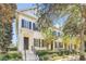 Daytime view of charming townhome with classic architecture and landscaping at 2891 Upper Park Rd, Orlando, FL 32814