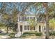 Two story home with grey shutters and white exterior at 2891 Upper Park Rd, Orlando, FL 32814