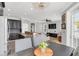 Modern kitchen features dark cabinetry, granite countertops, and breakfast bar at 2891 Upper Park Rd, Orlando, FL 32814