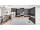 Modern kitchen boasting dark cabinetry, granite countertops, and stainless steel appliances at 2891 Upper Park Rd, Orlando, FL 32814