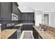 Modern kitchen with stainless steel appliances and granite countertops at 2891 Upper Park Rd, Orlando, FL 32814