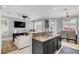 Updated kitchen with granite counters, dark cabinetry, and breakfast bar at 2891 Upper Park Rd, Orlando, FL 32814