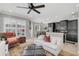 Bright living room showcasing a comfy sofa, large windows, and an open floor plan at 2891 Upper Park Rd, Orlando, FL 32814