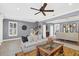 Open concept living room with comfortable seating and views to dining area at 2891 Upper Park Rd, Orlando, FL 32814