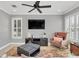 Relaxing living room with a plush chair, large TV, and a cozy atmosphere at 2891 Upper Park Rd, Orlando, FL 32814
