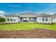 Expansive backyard featuring lush lawn and a view of the rear home exterior at 2982 Arranmore Dr, Ormond Beach, FL 32174