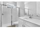 Bright bathroom featuring a walk-in shower, toilet, and a vanity with a white countertop at 2982 Arranmore Dr, Ormond Beach, FL 32174