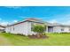Well-maintained exterior showcases lush landscaping and a neutral color palette at 2982 Arranmore Dr, Ormond Beach, FL 32174